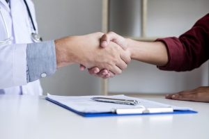 Biomedical Engineer Shaking Hand with Doctor